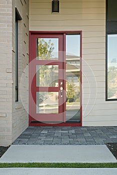 Closed modern red exterior door of a home