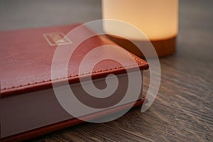 Closed Notebook with Desk Lamp