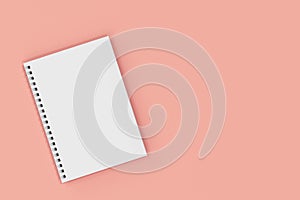 Closed notebook spiral bound on red background