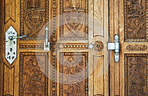 closed old brown door, gate with iron handles, prague, czech republic.