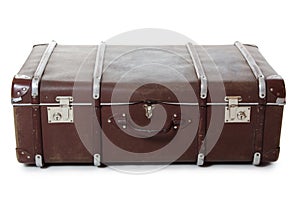 Closed old suitcase on white