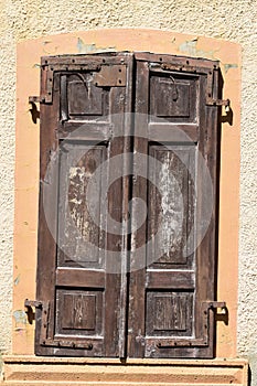 closed old weathered wooden shutters