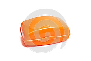 Closed orange soap dish isolated on white background