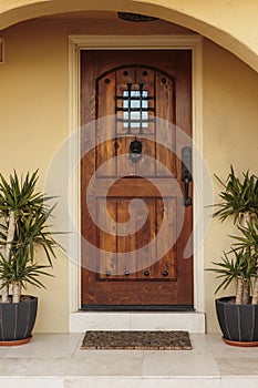 Closed Ornate Front Door of an Upscale Stucco House