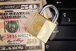 Closed padlock ,keyboard and money - data security