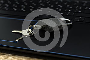 closed padlock with keys on the laptop keyboard concept data protection internet censorship