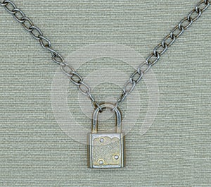 Closed padlock with metal link chain