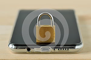 Closed padlock on smartphone - Concept of mobile security and data privacy
