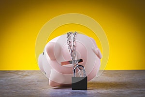 Closed piggy bank. Locked savings. Money protection concept.