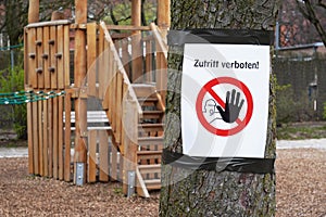 Closed playground with Zutritt verboten sign - meaning no entry in German