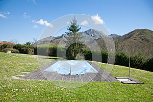 Closed pool with blue tarp