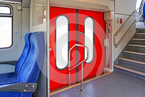 Closed red doors modern european economy class fast train