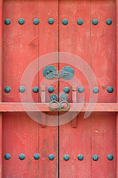 Closed red gate with a bar