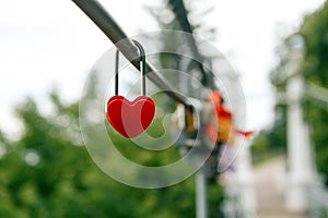 The closed red padlock in the form of heart