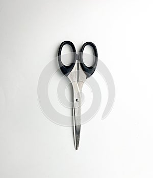 Closed scissors with black handle