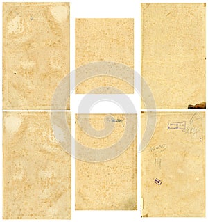 Closed seamless image of a sheet of old yellowed paper with dark brown spots, traces of time.