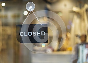 Closed sign hanging outside a restaurant, store, office or other