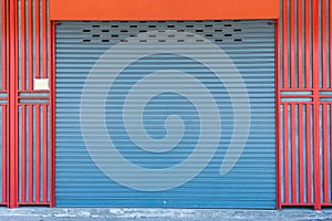 Closed steel shutter door of warehouse, storage or storefront for background and textured