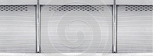 Closed steel shutter door of warehouse, storage or storefront for background and textured.