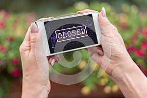 Closed stock market concept on a smartphone