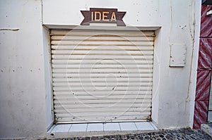 Closed storage garage doors with Idea written over it