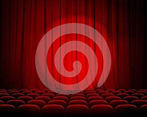 Closed theater red curtains with spotlight