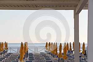 Closed umbrellas of a bathing establishment