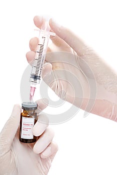 Closed up doctor hands injecting injection vaccine medicine