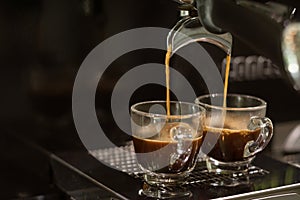 Closed-up espresso machine brewing coffee