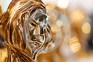 Closed up of gold Cannes lion award, trophy for winner of advertising agency in yearly festival in Cannes, France