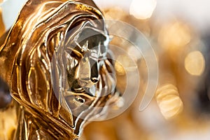 Closed up of gold Cannes lion award, trophy for winner of advertising agency in yearly festival in Cannes, France photo