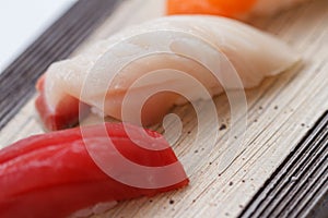 Closed up Hamachi Yellow Tail Fish Sushi from Sushi Set on the Stone Plate.