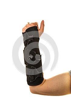 Closed up of hand in orthosis raised up