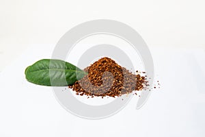 Closed up Heap of Ground Coffee on white background. Extract coffee beans to powder for make any beverage of coffee. Beans of