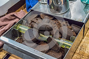 Closed up lumps of coffee grind filled on metal knock box