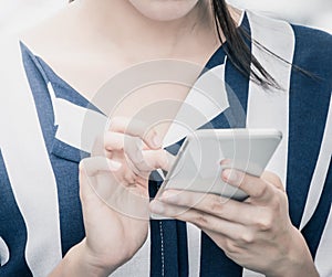 Closed up shot of woman using mobile phone to connect