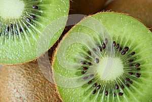 Closed up texture of cut in half vibrant green fresh and juicy ripe kiwi fruit