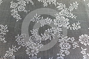 Closed up texture / pattern of a beautiful white crochet tablec