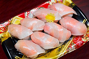 Closed up of tuna sushi set on plastic plate. Take home set. Japanese traditional food