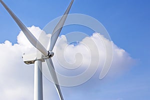 Closed up Wind turbine generating electricity on blue sky with clounds,Windmills for electric power ecology concept