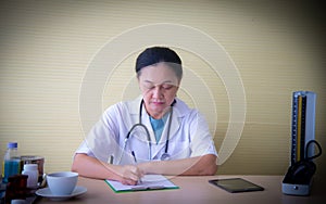 The closed up woman doctor with white uniform  and medical devices