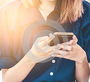 Closed up of woman hand using mobile phone to connect