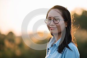 Closed up of young Asian woman smile portrait.