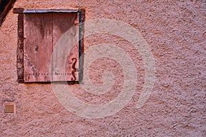 Closed Window and detail of a traditional French wall