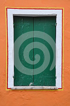 Closed window with green shutter