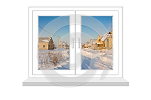 Closed window with a kind on winter landscape with new cottages