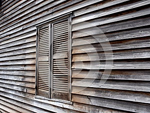 Closed window in a old wooden house