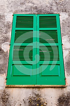 Closed window shutters made of wood