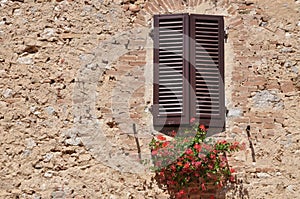 Closed window on a stone wall