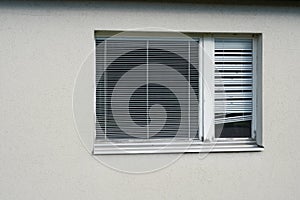 Closed window with a wooden frame with intern shutters. photo